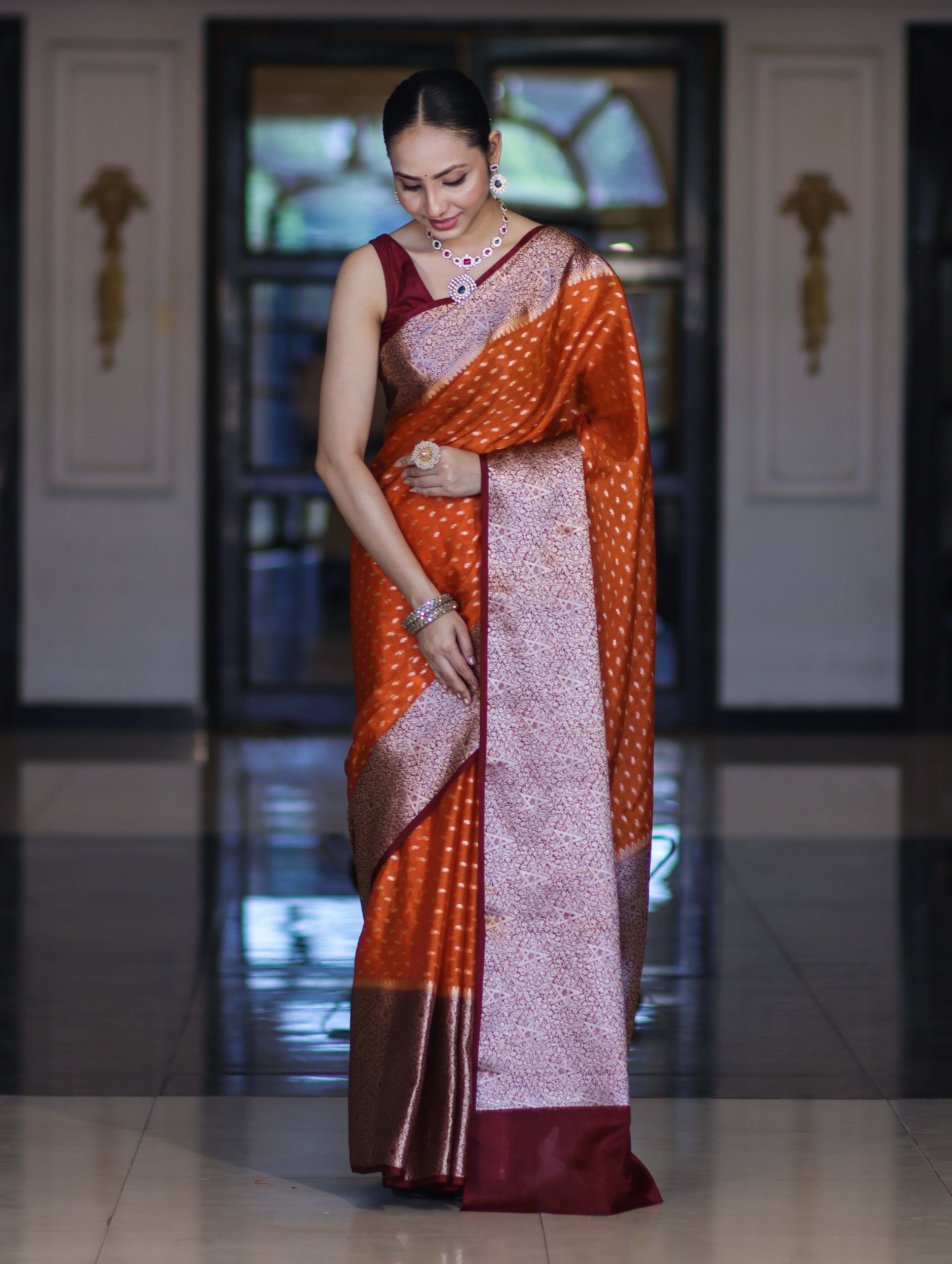 Banarasee Semi Chiffon Saree With Buti Design & Contrast Zari Border-Orange & Burgundy