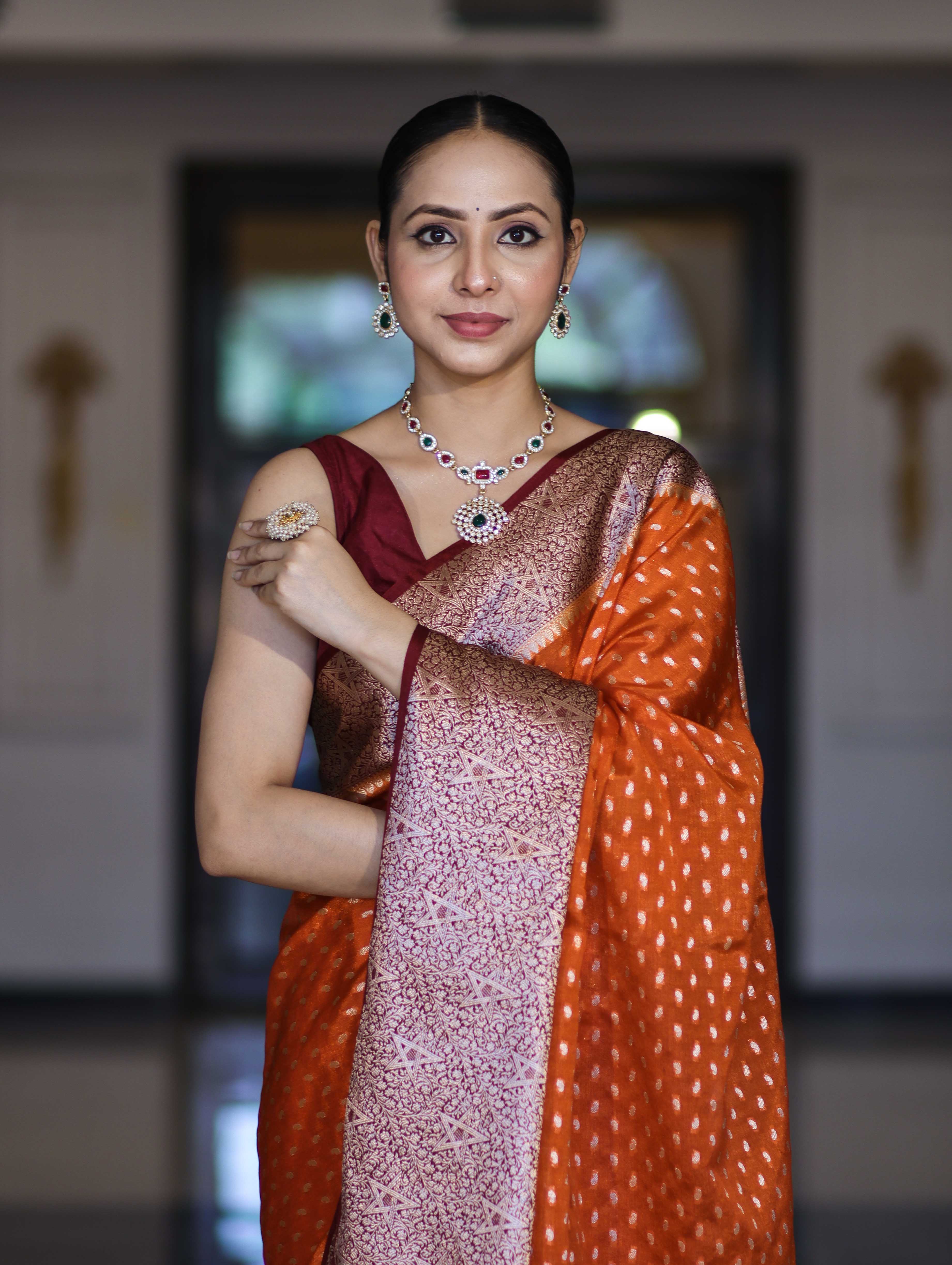 Banarasee Semi Chiffon Saree With Buti Design & Contrast Zari Border-Orange & Burgundy
