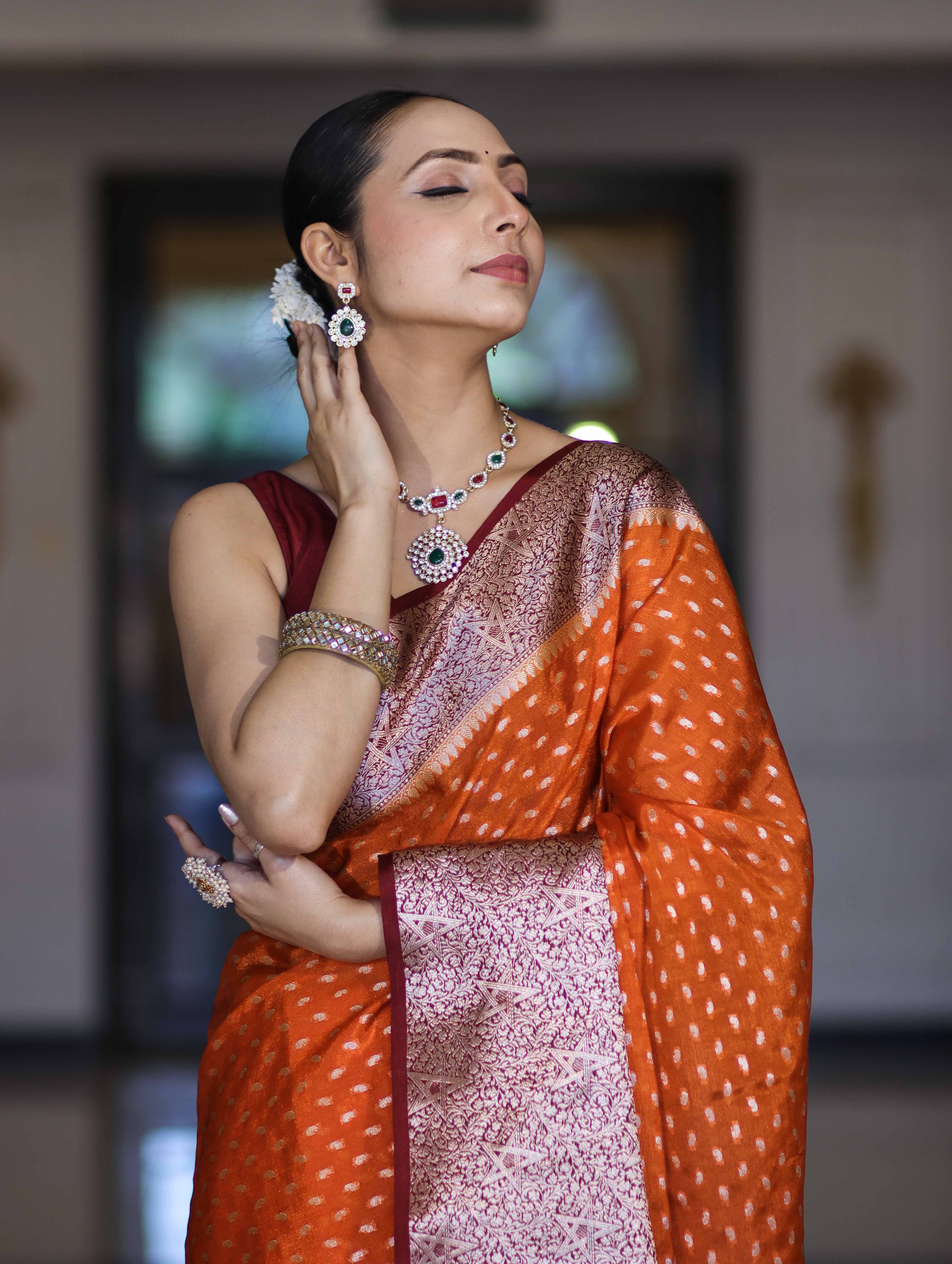Banarasee Semi Chiffon Saree With Buti Design & Contrast Zari Border-Orange & Burgundy