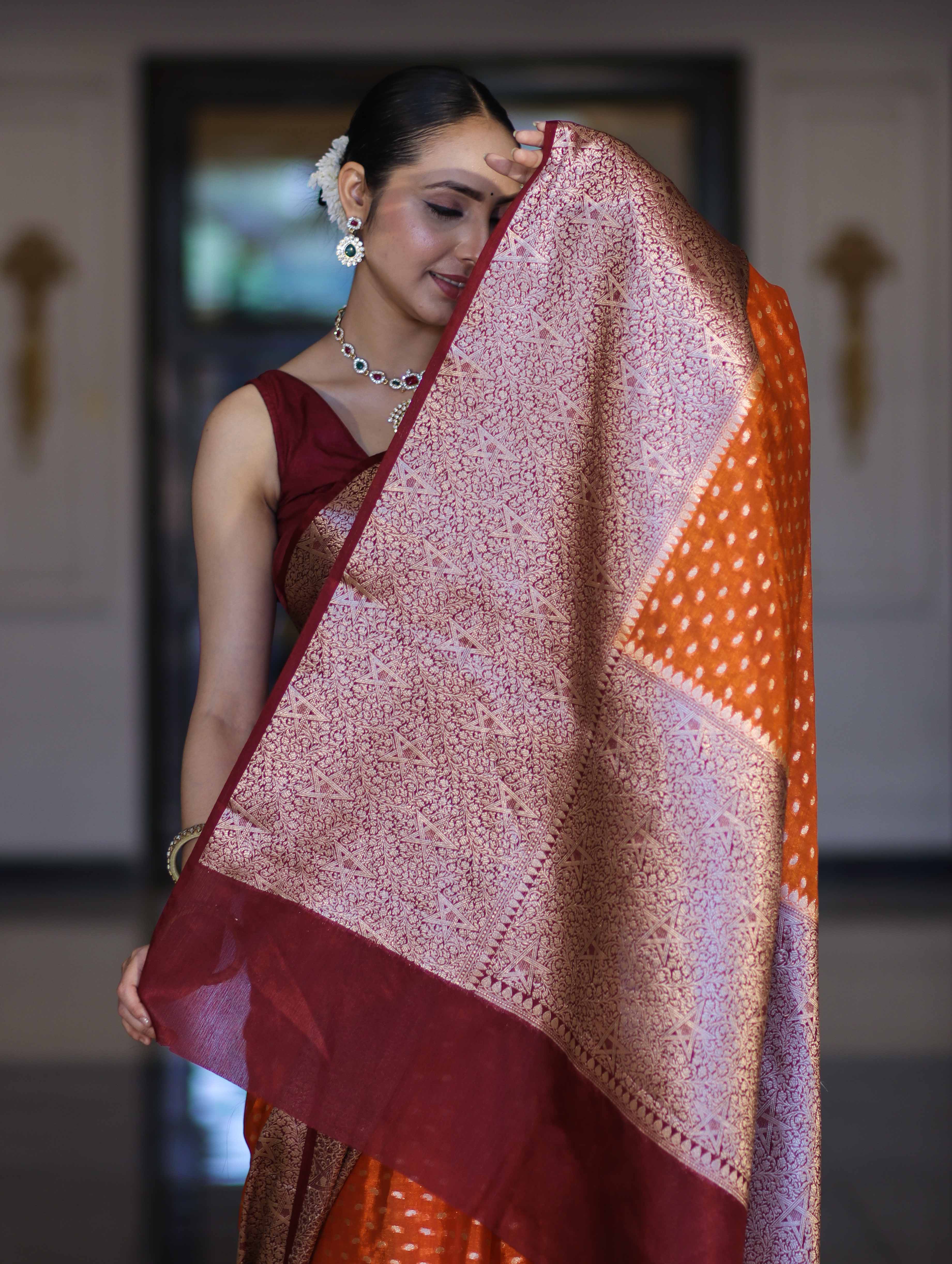 Banarasee Semi Chiffon Saree With Buti Design & Contrast Zari Border-Orange & Burgundy