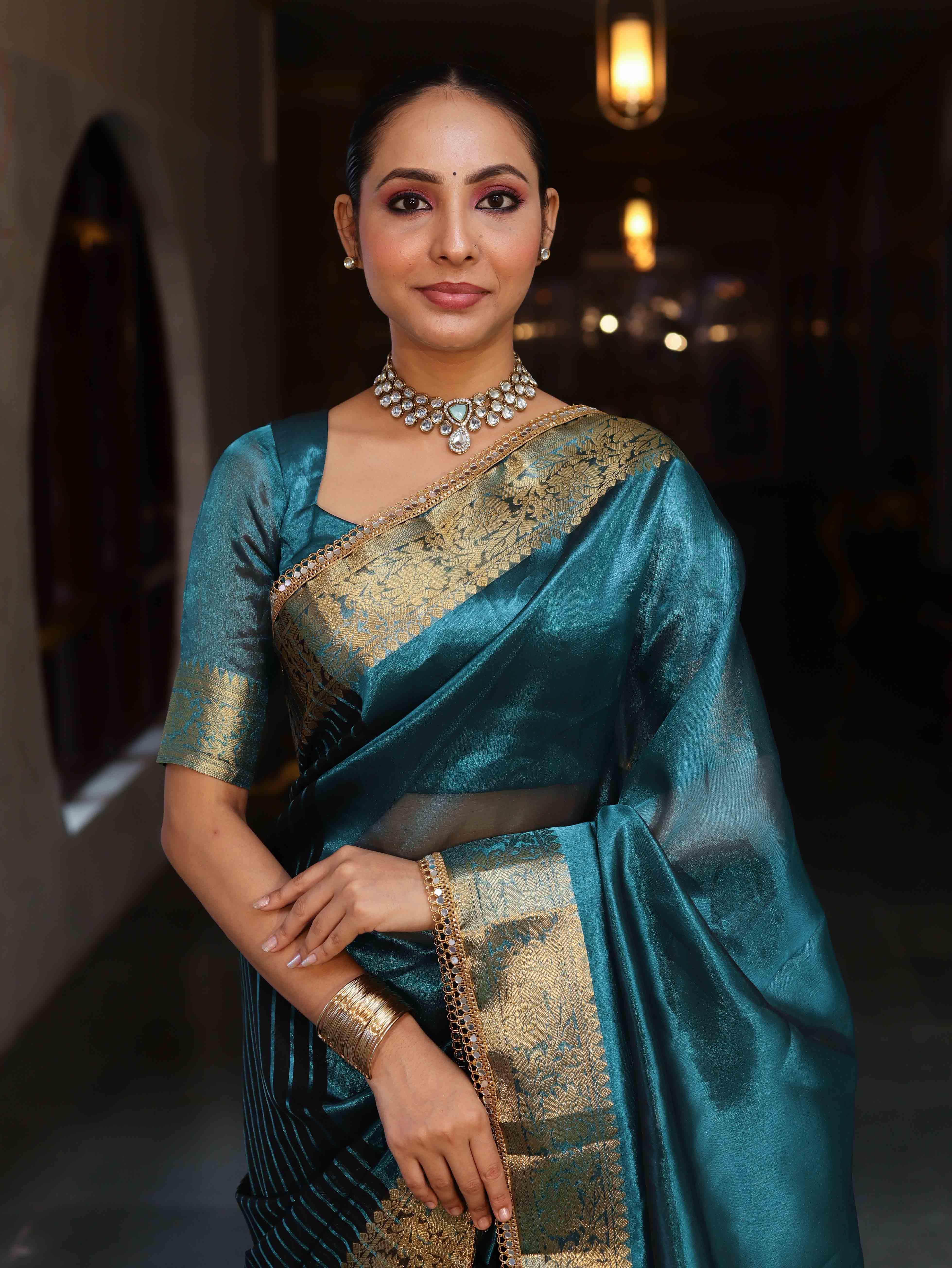 Banarasee Handwoven Dual Color Tissue Saree With Gold Zari Border & Lace-Teal Blue & Black