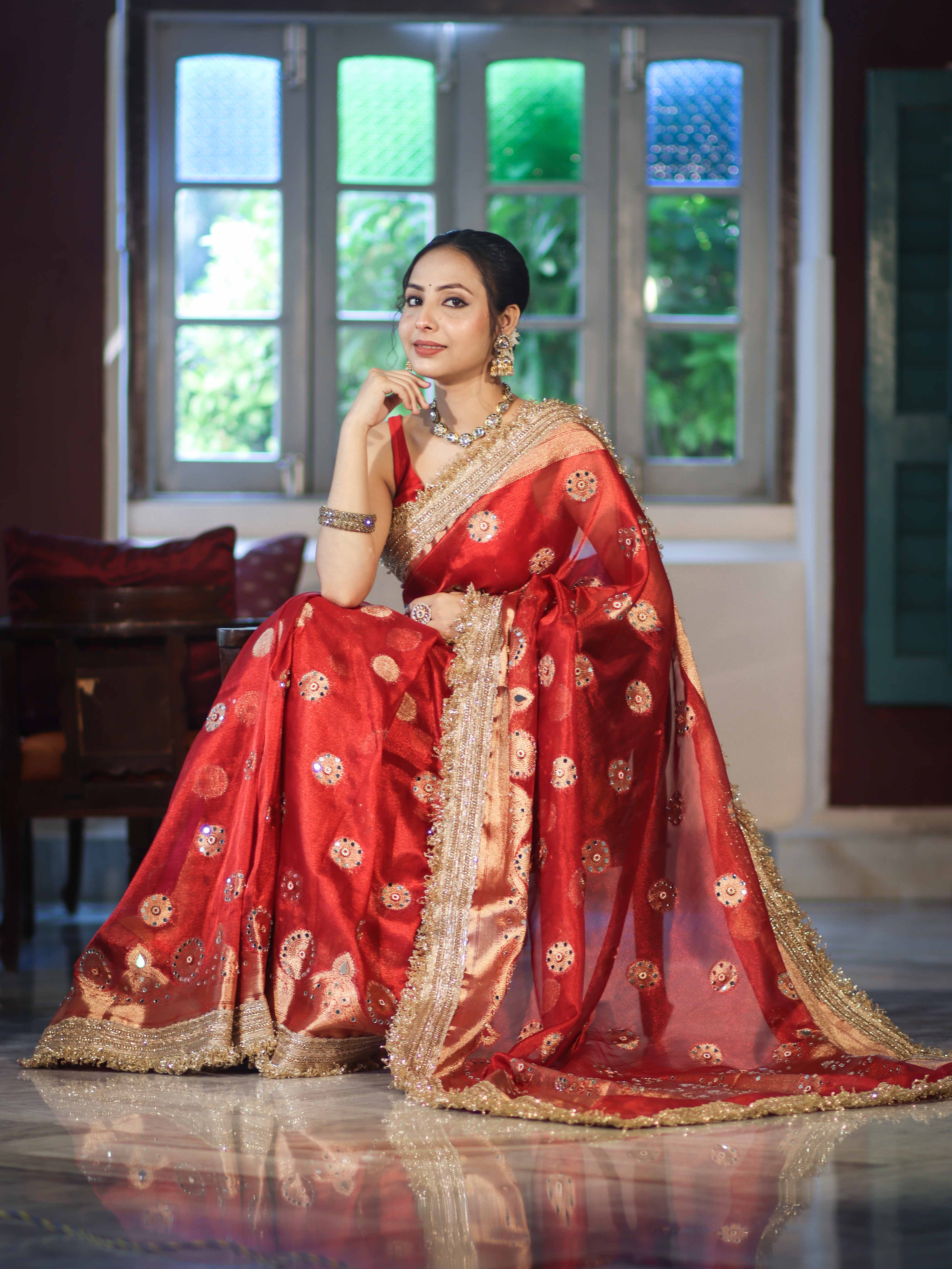 Banarasee Tissue Saree With Hand Embroidered Mirror Work Pearl Motifs & Zari Woven Pallu-Red