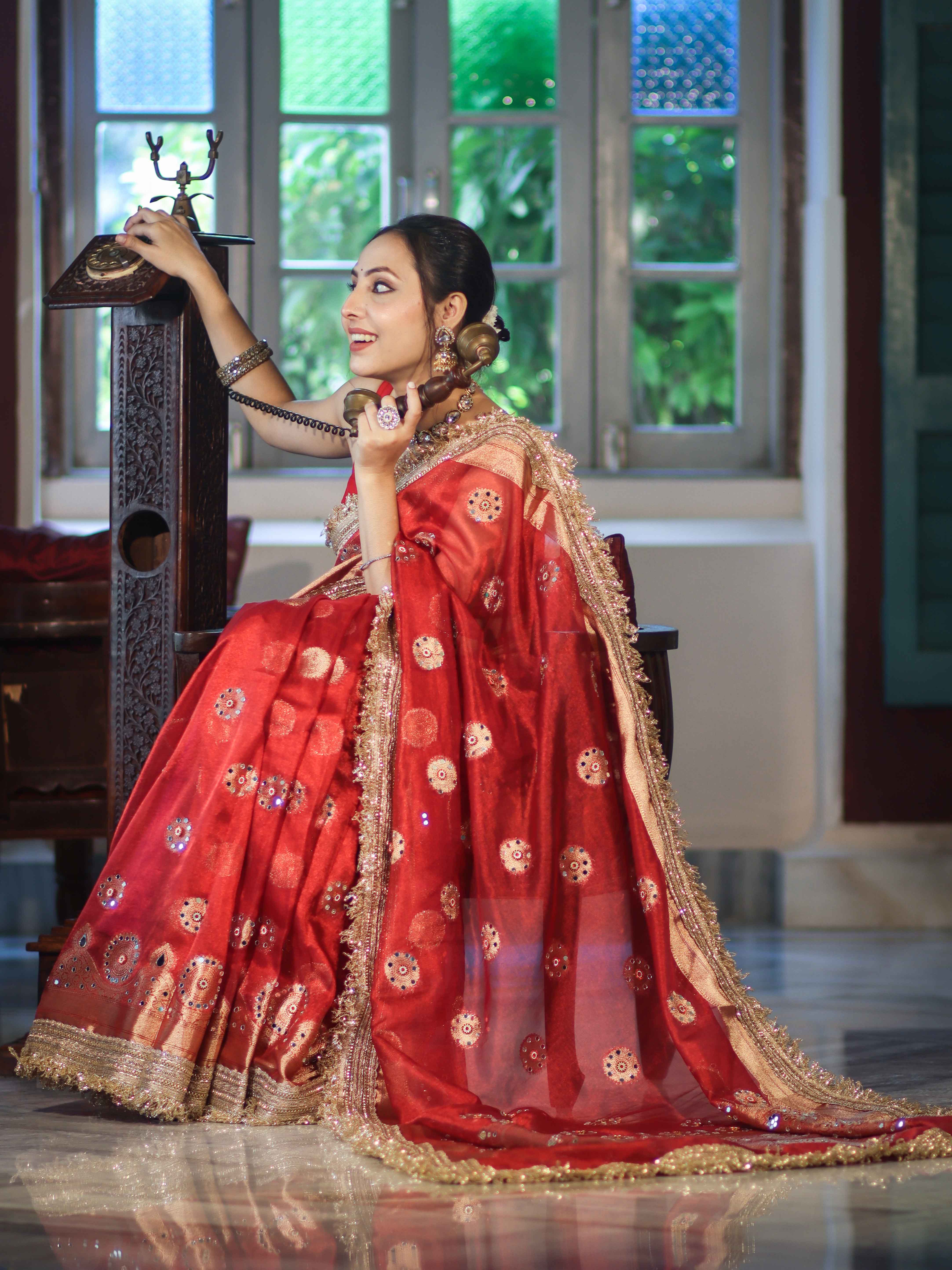 Banarasee Tissue Saree With Hand Embroidered Mirror Work Pearl Motifs & Zari Woven Pallu-Red