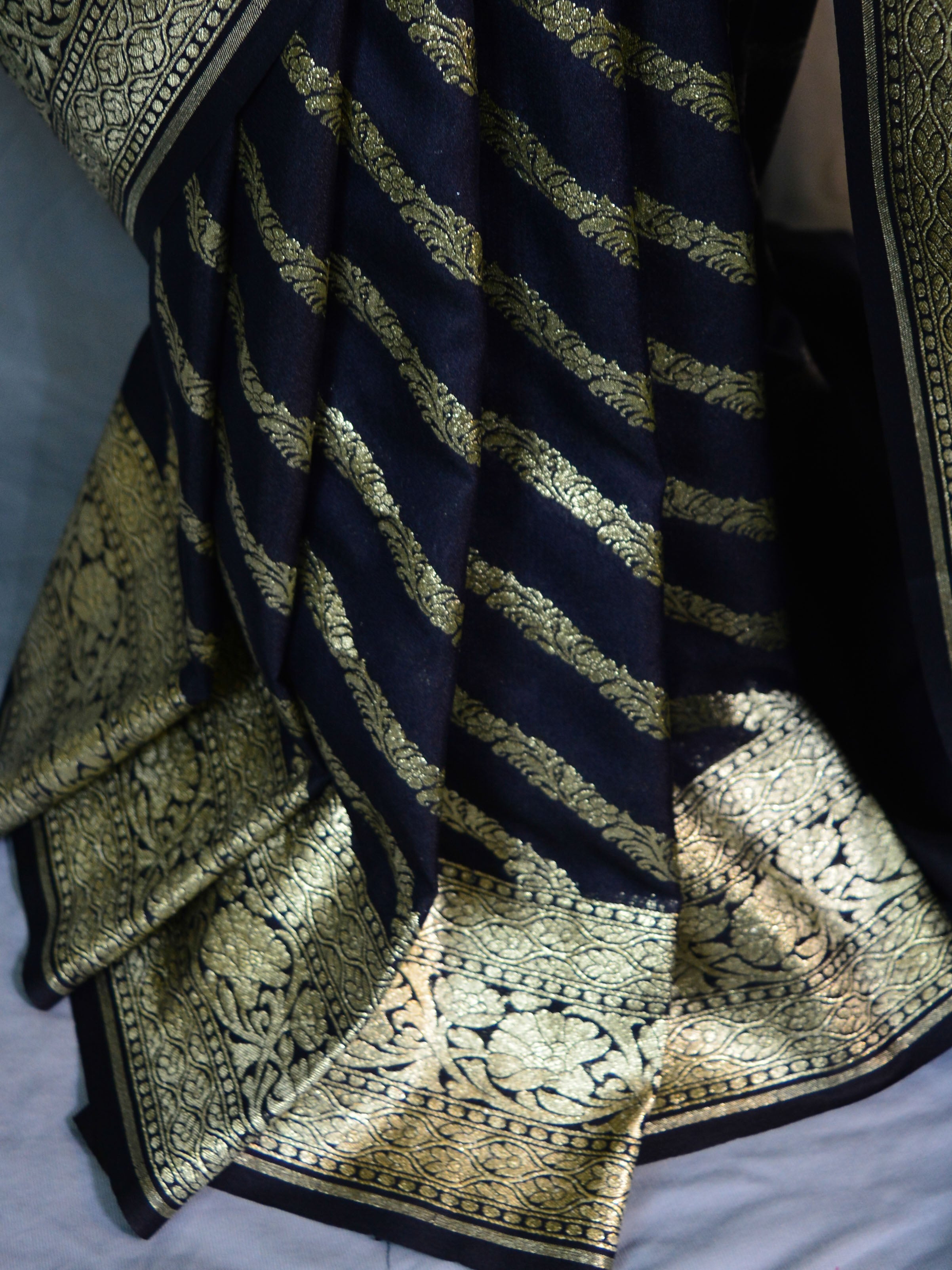 Banarasee Faux Georgette Saree With Zari Stripes Design & Floral Border-Black